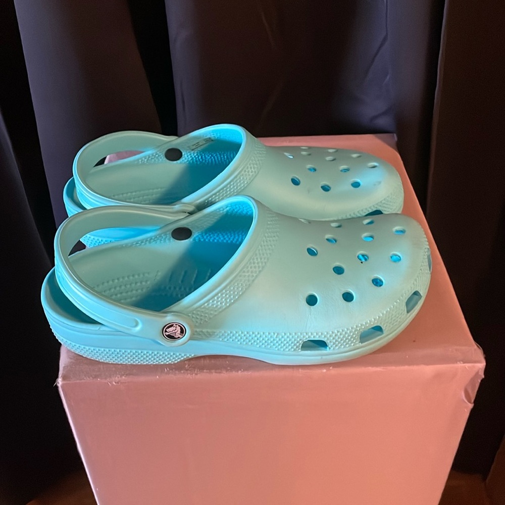 Crocs, teal color, men’s nine women’s 11